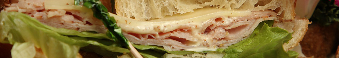 Eating Sandwich at Cafe 21 Express restaurant in Denver, CO.